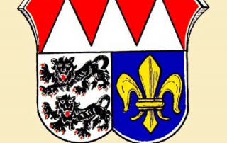 Wappen des Landkreises Würzburg von 1974 (Dr. Merzbacher, s. http://www.historisches-unterfranken.uni-wuerzburg.de/db/wappen/wappen/index.php?kreis=wue)